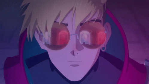 A Close Up Of A Person 'S Face With Glowing Glasses On GIF