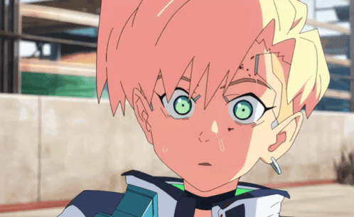 A Close Up Of A Person 'S Face With Green Eyes GIF