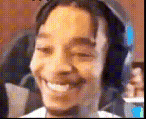 A Close Up Of A Person 'S Face With Headphones On . GIF