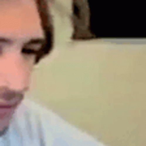 A Close Up Of A Person 'S Face With Headphones On And Their Eyes Closed . GIF