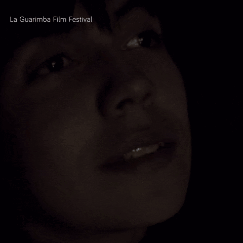a close up of a person 's face with la guarimba film festival written above