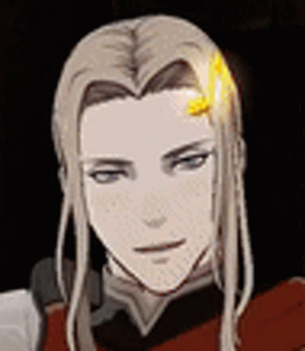 A Close Up Of A Person 'S Face With Long Hair And A Yellow Flower In Their Hair . GIF