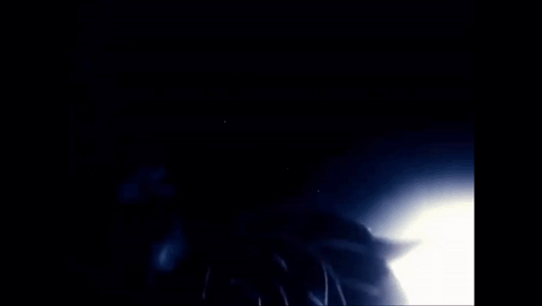 A Close Up Of A Person 'S Face With Many Eyes And A Finger On Their Mouth GIF