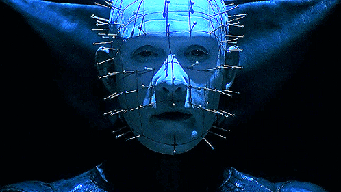 a close up of a person 's face with nails in it 's head