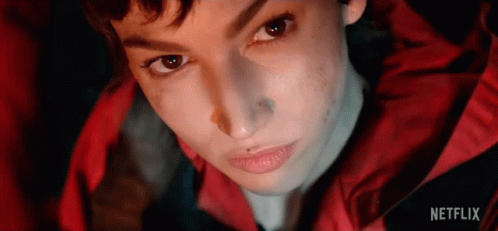 A Close Up Of A Person 'S Face With Netflix Written On The Bottom . GIF