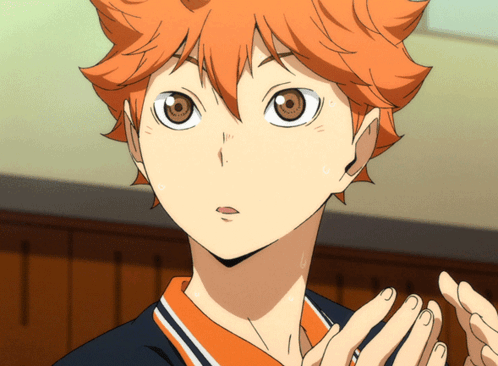 A Close Up Of A Person 'S Face With Orange Hair And Brown Eyes GIF