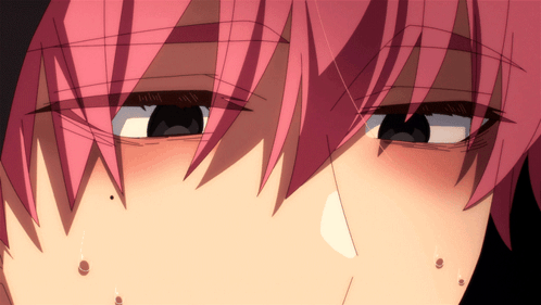 A Close Up Of A Person 'S Face With Pink Hair And Black Eyes GIF
