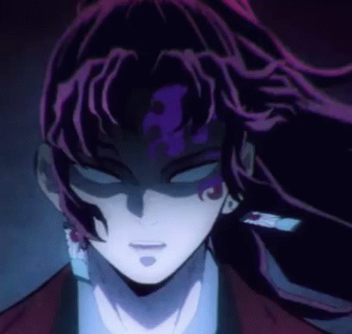 A Close Up Of A Person 'S Face With Purple Hair And A Dark Background . GIF