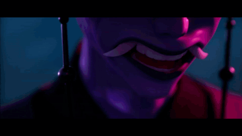 A Close Up Of A Person 'S Face With Purple Lights Behind Them GIF