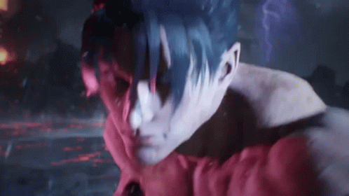 A Close Up Of A Person 'S Face With Red And Blue Paint On It . GIF