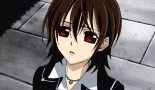 A Close Up Of A Person 'S Face With Red Eyes And A Necklace . GIF