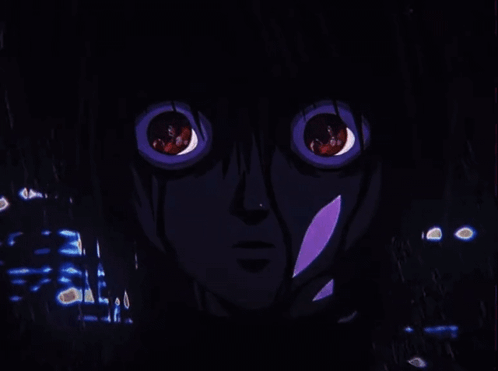 a close up of a person 's face with red eyes in a dark room