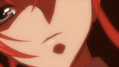A Close Up Of A Person 'S Face With Red Hair And A Red Spot GIF