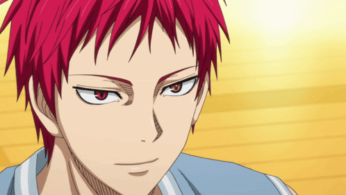 A Close Up Of A Person 'S Face With Red Hair And Red Eyes GIF