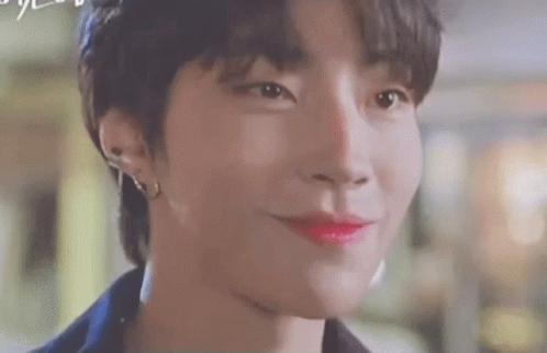 A Close Up Of A Person 'S Face With Red Lipstick On . GIF