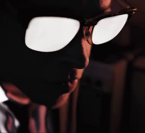 A Close Up Of A Person 'S Face With Sunglasses On Their Eyes GIF
