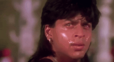 A Close Up Of A Person 'S Face With Tears Coming Out Of It . GIF