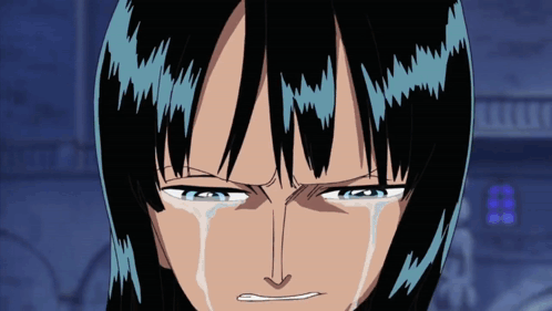 a close up of a person 's face with tears running down their face