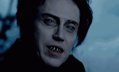 A Close Up Of A Person 'S Face With Teeth Showing GIF