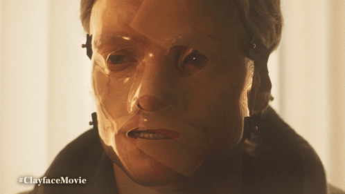 A Close Up Of A Person 'S Face With The Hashtag #Clayfacemovie On The Bottom GIF
