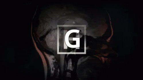 a close up of a person 's face with the letter g on it