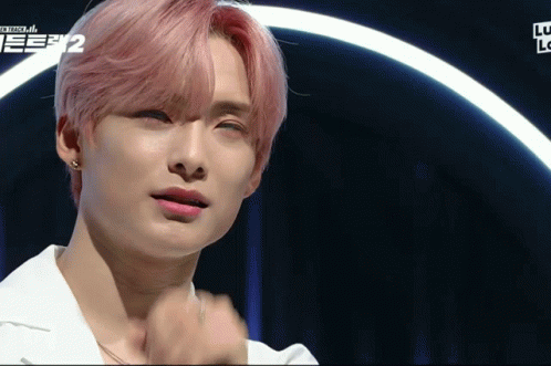 A Close Up Of A Person 'S Face With The Number 2 On The Bottom Right GIF