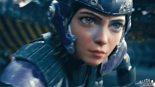 A Close Up Of A Person 'S Face With The Word Alita On The Bottom Right GIF