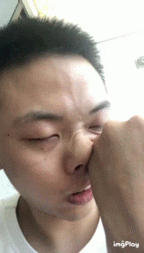 A Close Up Of A Person 'S Face With The Word Imgplay Visible GIF