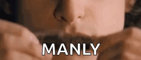 A Close Up Of A Person 'S Face With The Word Manly Written In White Letters . GIF