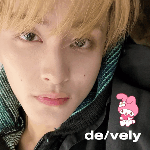 A Close Up Of A Person 'S Face With The Words De / Vely On The Bottom GIF
