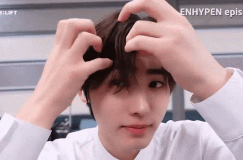 A Close Up Of A Person 'S Face With The Words Enhypen Ep.s. Visible GIF