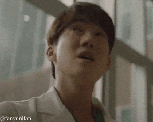 A Close Up Of A Person 'S Face With The Words Fanyunifan Written Below It GIF