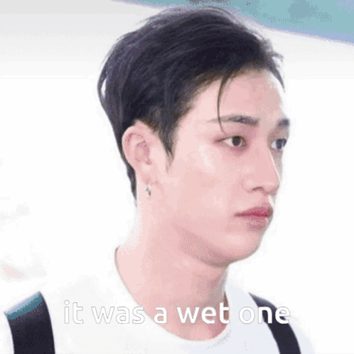 A Close Up Of A Person 'S Face With The Words `` It Was A Wet One '' Written On The Bottom . GIF