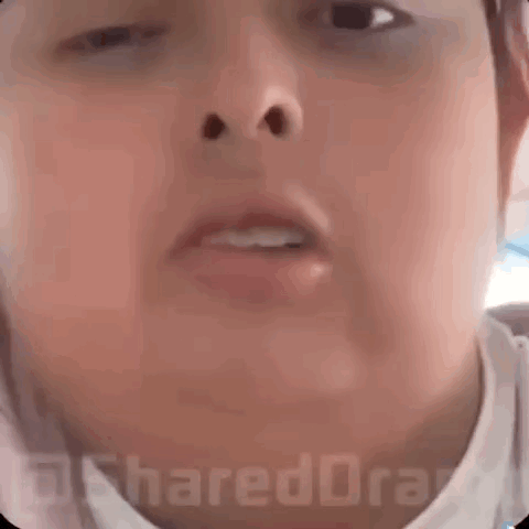 a close up of a person 's face with the words " not coming to my " written on it