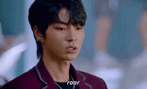 A Close Up Of A Person 'S Face With The Words `` Roar '' Written On The Bottom . GIF