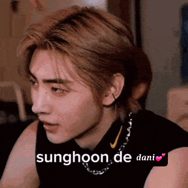 A Close Up Of A Person 'S Face With The Words Sunghoon De Dani GIF