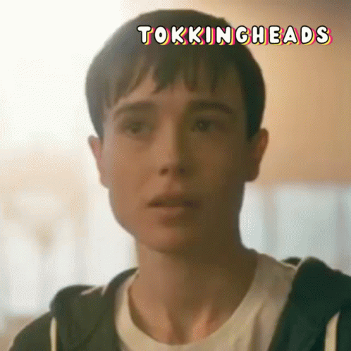 A Close Up Of A Person 'S Face With The Words Tokingheads Written On It . GIF
