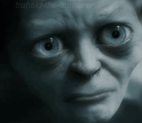 A Close Up Of A Person 'S Face With The Words Trahald-The-Burrower Written On The Bottom GIF