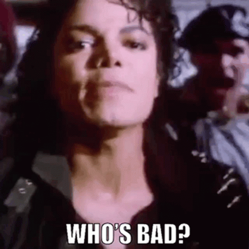 a close up of a person 's face with the words `` who 's bad ? ''