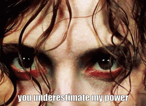 A Close Up Of A Person 'S Face With The Words " You Underestimate My Power " Above It GIF