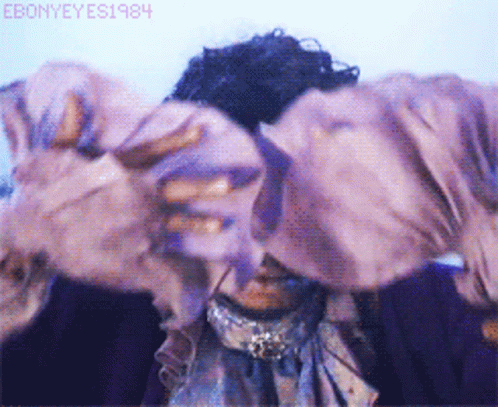 A Close Up Of A Person 'S Face With The Year 1984 On The Bottom Left GIF
