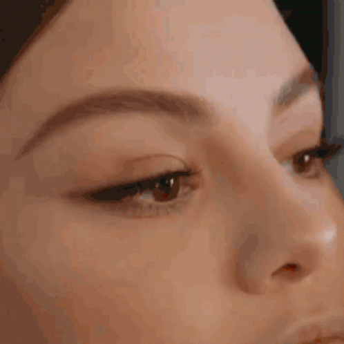A Close Up Of A Person 'S Face With Their Eyes Closed . GIF