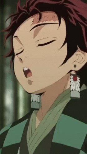 A Close Up Of A Person 'S Face With Their Eyes Closed And A Flower Earring GIF