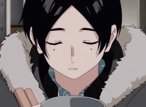 A Close Up Of A Person 'S Face With Their Eyes Closed And A Fur Collar GIF