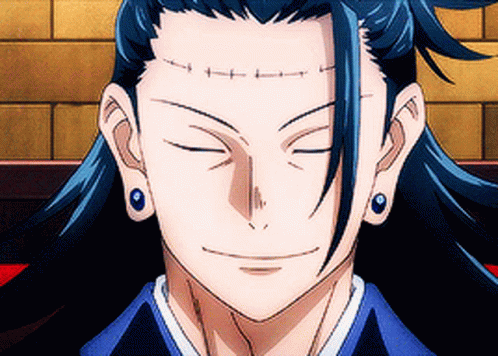 A Close Up Of A Person 'S Face With Their Eyes Closed And Earrings On . GIF