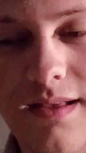 A Close Up Of A Person 'S Face With Their Eyes Closed And Mouth Open . GIF