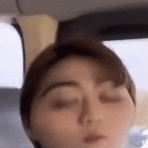A Close Up Of A Person 'S Face With Their Eyes Closed . GIF