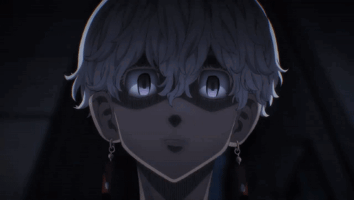 A Close Up Of A Person 'S Face With Their Eyes Glowing In The Dark GIF