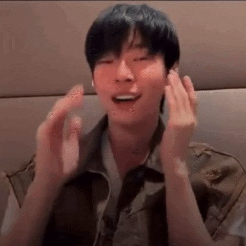 A Close Up Of A Person 'S Face With Their Hands In Front Of Their Face . GIF