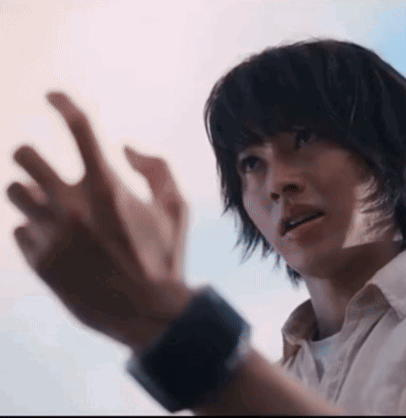 A Close Up Of A Person 'S Face With Their Hands Out GIF